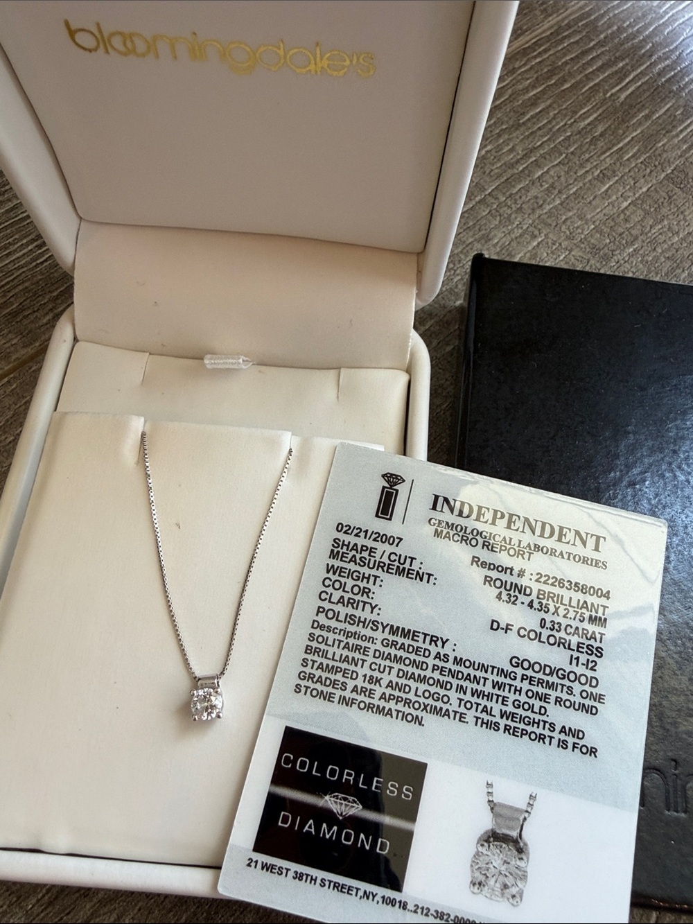 Bloomingdale's Diamond Solitaire Pendant with one brilliant cut diamond in gold.